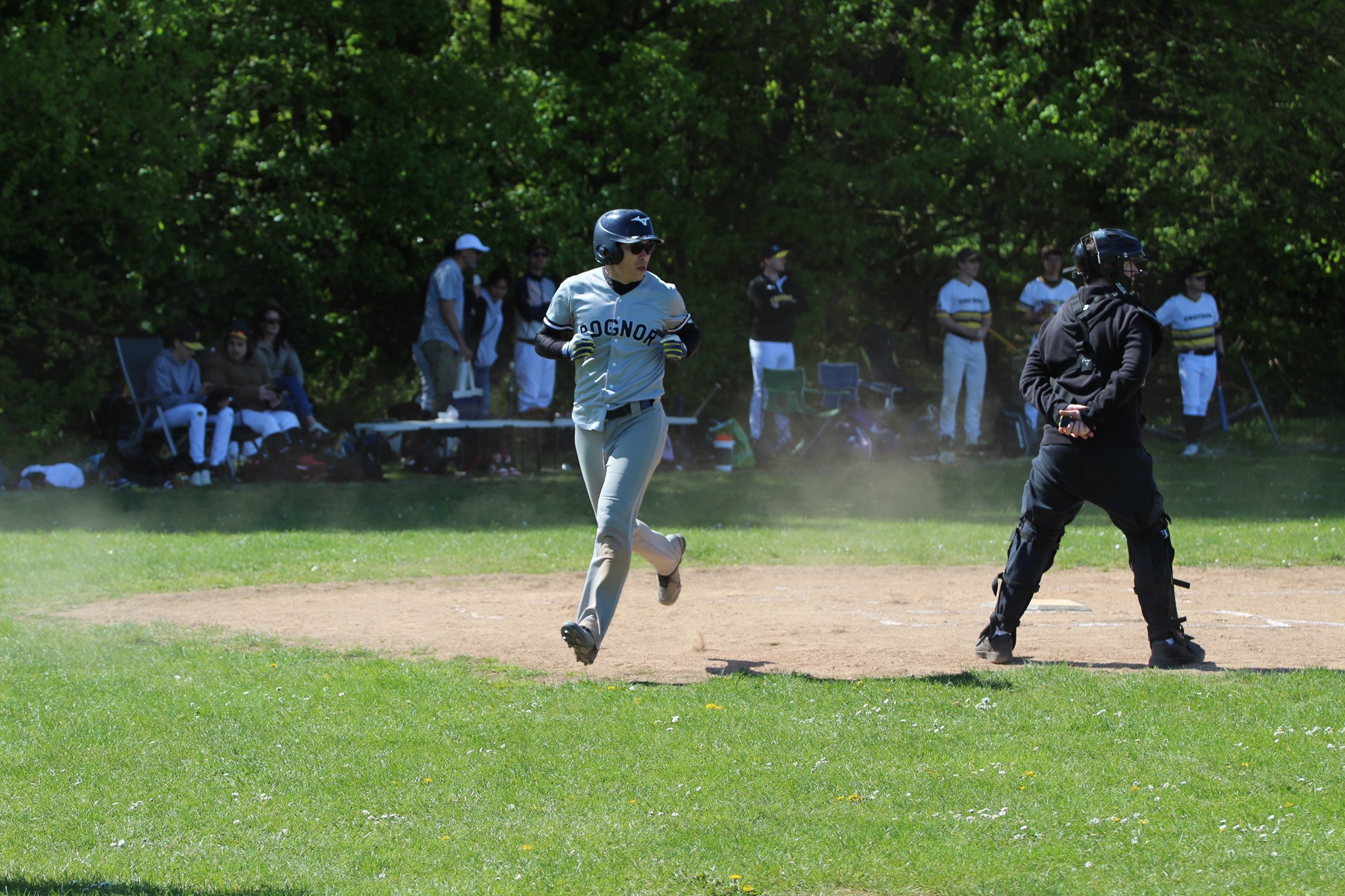 Baseball player crossing home plate